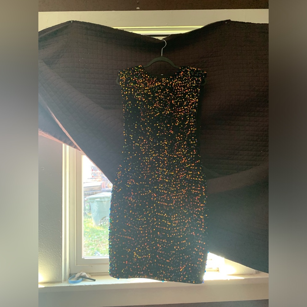 Sequin mini dress with low cut sides